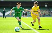 11 June 2025; Dáire Treanor of St Mary’s NS, Threemilehouse, Monaghan, right, in action against Conor Doorley of Glanduff NS, Roscommon, during the FAI Primary 5s Finals Day at the Aviva Stadium in Dublin. Photo by Seb Daly/Sportsfile