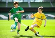 11 June 2025; Dáire Treanor of St Mary’s NS, Threemilehouse, Monaghan, right, in action against Conor Doorley of Glanduff NS, Roscommon, during the FAI Primary 5s Finals Day at the Aviva Stadium in Dublin. Photo by Seb Daly/Sportsfile