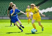 11 June 2025; Sinéad Nic Meanaman of Scoil Náisiúnta an Choimín, Dún na nGall, right, in action against Aimee Hickey of St Leonard’s NS, Dunnamaggin, Kilkenny, during the FAI Primary 5s Finals Day at the Aviva Stadium in Dublin. Photo by Seb Daly/Sportsfile