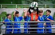 11 June 2025; Lusk SNS, Dublin, captain Finn Hurley lifts the trophy alongside his teammates after winning the section C cup, for mixed large sized schools, during the FAI Primary 5s Finals Day at the Aviva Stadium in Dublin. Photo by Seb Daly/Sportsfile