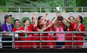 11 June 2025; Monaleen NS, Limerick, players celebrate with the trophy after winning the girls section C cup, for large sized schools, during the FAI Primary 5s Finals Day at the Aviva Stadium in Dublin. Photo by Seb Daly/Sportsfile
