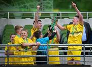 11 June 2025; Scoil Íosagáin, Buncrana, Inishowen, Donegal, captain Danny Bradley, right, and teammates celebrate with the trophy after winning the Football For All Qualifiers during the FAI Primary 5s Finals Day at the Aviva Stadium in Dublin. Photo by Seb Daly/Sportsfile