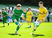 11 June 2025; Conor Doorley of Glanduff NS, Roscommon, left, in action against Callum Mc Cormilla of St Mary’s NS, Threemilehouse, Monaghan, during the FAI Primary 5s Finals Day at the Aviva Stadium in Dublin. Photo by Seb Daly/Sportsfile