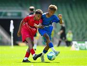 11 June 2025; Kingsley Crosby of Rathmore NS, Baltimore, Cork, left, in action against Kyan Ó Foghlú of Gaelscoil Uí Chéadaigh, Wicklow, during the FAI Primary 5s Finals Day at the Aviva Stadium in Dublin. Photo by Seb Daly/Sportsfile
