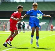 11 June 2025; Kyan Ó Foghlú of Gaelscoil Uí Chéadaigh, Wicklow, right, in action against Kingsley Crosby of Rathmore NS, Baltimore, Cork, during the FAI Primary 5s Finals Day at the Aviva Stadium in Dublin. Photo by Seb Daly/Sportsfile