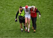 8 June 2025; James Burke of Kildare leaves the pitch to receive medical attention for an injury during the Joe McDonagh Cup final match between Kildare and Laois at Croke Park in Dublin. Photo by Piaras Ó Mídheach/Sportsfile