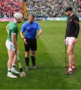 7 June 2025; Referee Thomas Walsh performs the coin toss with team captains Cian Lynch of Limerick and Robert Downey of Cork before the Munster GAA Hurling Senior Championship final match between Limerick and Cork at TUS Gaelic Grounds in Limerick. Photo by Piaras Ó Mídheach/Sportsfile
