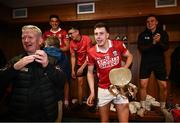 7 June 2025; Cork captain Robert Downey celebrates with the Mick Mackey Cup in the dressing room after his side's victory in the Munster GAA Hurling Senior Championship final match between Limerick and Cork at TUS Gaelic Grounds in Limerick. Photo by Piaras Ó Mídheach/Sportsfile