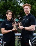 12 June 2025; PwC GAA/GPA Player of the Month for May in hurling, Cian Lynch of Limerick, and PwC GPA Player of the Month for May in camogie, Niamh Rockett of Waterford, with their awards at PwC offices in Limerick today. Photo by Shauna Clinton/Sportsfile
