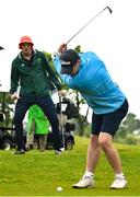 12 June 2025; Olympic Bronze Medallist in Rowing Philip Doyle OLY watches a shot by Vincent Foley of Golf Ireland during the annual Team Ireland Olympic Golf Fundraiser at The K Club in Kildare in support of the Make a Difference fund, helping athletes pursue their sporting dreams. Photo by David Fitzgerald/Sportsfile