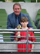 11 June 2025; John Deane Moran of Catherine McAuley School, Limerick, is presented with his Player of the Tournament award for the Football for All Qualifiers by FAI board member Nixon Morton during the FAI Primary 5s Finals Day at the Aviva Stadium in Dublin. Photo by Seb Daly/Sportsfile