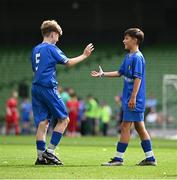 11 June 2025; Jamie Walsh of Lusk SNS, Dublin, right, celebrates with teammate Harry Gleeson after scoring a goal during the FAI Primary 5s Finals Day at the Aviva Stadium in Dublin. Photo by Seb Daly/Sportsfile