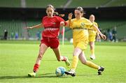11 June 2025; Esme McDonald of Monaleen NS, Limerick, in action against Kaci-Rae Kelly of Scoil Íosagáin, Buncrana, Inishowen, Donegal, during the FAI Primary 5s Finals Day at the Aviva Stadium in Dublin. Photo by Seb Daly/Sportsfile