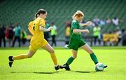 11 June 2025; Sarah Ní Chonaill of Gaelscoil Mhic Amhlaigh, Gaillimh, in action against Kaci-Rae Kelly of Scoil Íosagáin, Buncrana, Inishowen, Donegal, during the FAI Primary 5s Finals Day at the Aviva Stadium in Dublin. Photo by Seb Daly/Sportsfile