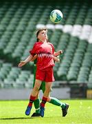 11 June 2025; Senan Ring of Scoil Niocláis, Corcaigh, in action against Pádraig Burke of Scoil Íosa, Oranmore, Galway, during the FAI Primary 5s Finals Day at the Aviva Stadium in Dublin. Photo by Seb Daly/Sportsfile