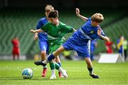 11 June 2025; Max Dooley of Scoil Íosa, Oranmore, Galway, in action against Harry Gleeson of Lusk SNS, Dublin, during the FAI Primary 5s Finals Day at the Aviva Stadium in Dublin. Photo by Seb Daly/Sportsfile