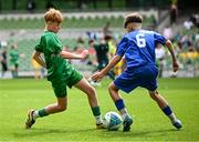 11 June 2025; Kyle Cormican of Scoil Íosa, Oranmore, Galway, in action against Dylan Maguire of Lusk SNS, Dublin, during the FAI Primary 5s Finals Day at the Aviva Stadium in Dublin. Photo by Seb Daly/Sportsfile