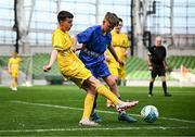 11 June 2025; Cillian Doherty of Scoil Íosagáin, Buncrana, Inishowen, Donegal, in action against Lennon O’Brien of Scoil Eoin, Crumlin, Dublin, during the FAI Primary 5s Finals Day at the Aviva Stadium in Dublin. Photo by Seb Daly/Sportsfile