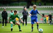 11 June 2025; Patryk Jachymczak of Lusk SNS, Dublin, in action against Pádraig Burke of Scoil Íosa, Oranmore, Galway, during the FAI Primary 5s Finals Day at the Aviva Stadium in Dublin. Photo by Seb Daly/Sportsfile