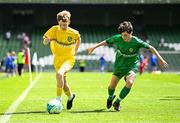 11 June 2025; Harry McGeough of Scoil Íosagáin, Buncrana, Inishowen, Donegal, in action against Pádraig Burke of Scoil Íosa, Oranmore, Galway, during the FAI Primary 5s Finals Day at the Aviva Stadium in Dublin. Photo by Seb Daly/Sportsfile