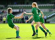 11 June 2025; Sarah Ní Chonaill of Gaelscoil Mhic Amhlaigh, Gaillimh, centre, celebrates with teammates after scoring a goal during the FAI Primary 5s Finals Day at the Aviva Stadium in Dublin. Photo by Seb Daly/Sportsfile