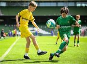11 June 2025; Harry McGeough of Scoil Íosagáin, Buncrana, Inishowen, Donegal, in action against Pádraig Burke of Scoil Íosa, Oranmore, Galway, during the FAI Primary 5s Finals Day at the Aviva Stadium in Dublin. Photo by Seb Daly/Sportsfile