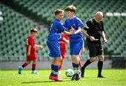 11 June 2025; Harry Gleeson of Lusk SNS, Dublin, right, celebrates with teammate Miki Jachymczak after scoring a goal during the FAI Primary 5s Finals Day at the Aviva Stadium in Dublin. Photo by Seb Daly/Sportsfile
