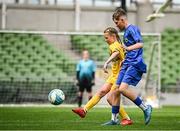 11 June 2025; Méabh Scanlon of Scoil Íosagáin, Buncrana, Inishowen, Donegal, in action against Lennon O’Brien of Scoil Eoin, Crumlin, Dublin, during the FAI Primary 5s Finals Day at the Aviva Stadium in Dublin. Photo by Seb Daly/Sportsfile
