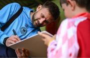 13 June 2025; St Patrick's Athletic goalkeeper Danny Rogers signs autographs for supporters before the SSE Airtricity Men's Premier Division match between St Patrick's Athletic and Drogheda United at Richmond Park in Dublin. Photo by Shauna Clinton/Sportsfile