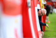 13 June 2025; A Shelbourne supporter hangs his flag before the SSE Airtricity Men's Premier Division match between Shelbourne and Shamrock Rovers at Tolka Park in Dublin. Photo by Stephen McCarthy/Sportsfile