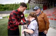 13 June 2025; Derry City goalkeeper Brian Maher signs the jersey of Derry City supporter Briona McCallion-Whelan before the SSE Airtricity Men's Premier Division match between Derry City and Galway United at The Ryan McBride Brandywell Stadium in Derry. Photo by Ramsey Cardy/Sportsfile