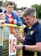 13 June 2025; St Patrick's Athletic manager Stephen Kenny signs autographs for supporters before the SSE Airtricity Men's Premier Division match between St Patrick's Athletic and Drogheda United at Richmond Park in Dublin. Photo by Shauna Clinton/Sportsfile