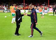13 June 2025; Shelbourne manager Damien Duff shakes hands with Shamrock Rovers kit manager John Cregan, left, before the SSE Airtricity Men's Premier Division match between Shelbourne and Shamrock Rovers at Tolka Park in Dublin. Photo by Stephen McCarthy/Sportsfile