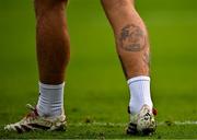13 June 2025; A view of a tattoo on the leg of Shamrock Rovers goalkeeper Lee Stacey before the SSE Airtricity Men's Premier Division match between Shelbourne and Shamrock Rovers at Tolka Park in Dublin. Photo by Sam Barnes/Sportsfile