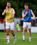 13 June 2025; Mason Melia of St Patrick's Athletic, right, warms up before the SSE Airtricity Men's Premier Division match between St Patrick's Athletic and Drogheda United at Richmond Park in Dublin. Photo by Shauna Clinton/Sportsfile