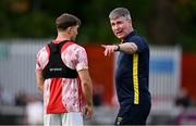 13 June 2025; St Patrick's Athletic manager Stephen Kenny, right, speaks with Anto Breslin before the SSE Airtricity Men's Premier Division match between St Patrick's Athletic and Drogheda United at Richmond Park in Dublin. Photo by Shauna Clinton/Sportsfile