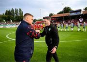13 June 2025; Shamrock Rovers manager Stephen Bradley, right, and Shelbourne manager Damien Duff shake hands before the SSE Airtricity Men's Premier Division match between Shelbourne and Shamrock Rovers at Tolka Park in Dublin. Photo by Stephen McCarthy/Sportsfile