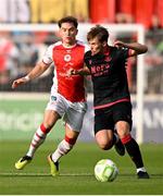 13 June 2025; Owen Lambe of Drogheda United in action against Anto Breslin of St Patrick's Athletic during the SSE Airtricity Men's Premier Division match between St Patrick's Athletic and Drogheda United at Richmond Park in Dublin. Photo by Shauna Clinton/Sportsfile