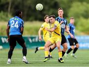 13 June 2025; Sean McGrath of Kerry in action against Athlone Town players, from left, Gideon Tetteh and Kailin Barlow during the SSE Airtricity Men's First Division match between Athlone Town and Kerry at Athlone Town Stadium in Westmeath. Photo by Thomas Flinkow/Sportsfile