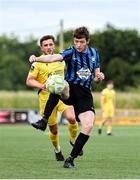 13 June 2025; Ben Feeney of Athlone Town in action against Alex Dunne of Kerry during the SSE Airtricity Men's First Division match between Athlone Town and Kerry at Athlone Town Stadium in Westmeath. Photo by Thomas Flinkow/Sportsfile