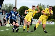 13 June 2025; Oisin Duffy in action against Ronan Teahan, centre, and Alex Dunne of Kerry during the SSE Airtricity Men's First Division match between Athlone Town and Kerry at Athlone Town Stadium in Westmeath. Photo by Thomas Flinkow/Sportsfile
