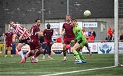 13 June 2025; Kevin Holt of Derry City scores his side's first goal past Galway United goalkeper Evan Watts during the SSE Airtricity Men's Premier Division match between Derry City and Galway United at The Ryan McBride Brandywell Stadium in Derry. Photo by Ramsey Cardy/Sportsfile