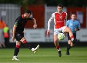 13 June 2025; Ryan Brennan of Drogheda United in action against Kian Leavy of St Patrick's Athletic during the SSE Airtricity Men's Premier Division match between St Patrick's Athletic and Drogheda United at Richmond Park in Dublin. Photo by Shauna Clinton/Sportsfile
