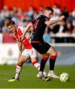 13 June 2025; Anto Breslin of St Patrick's Athletic is tackled by Warren Davis of Drogheda United during the SSE Airtricity Men's Premier Division match between St Patrick's Athletic and Drogheda United at Richmond Park in Dublin. Photo by Shauna Clinton/Sportsfile