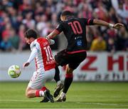 13 June 2025; Kian Leavy of St Patrick's Athletic is fouled by Douglas James-Taylor of Drogheda United during the SSE Airtricity Men's Premier Division match between St Patrick's Athletic and Drogheda United at Richmond Park in Dublin. Photo by Shauna Clinton/Sportsfile