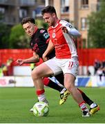 13 June 2025; Jay McClelland of St Patrick's Athletic in action against Darragh Markey of Drogheda United during the SSE Airtricity Men's Premier Division match between St Patrick's Athletic and Drogheda United at Richmond Park in Dublin. Photo by Shauna Clinton/Sportsfile