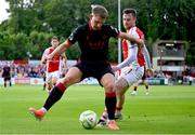 13 June 2025; Jay McClelland of St Patrick's Athletic tackles George Cooper of Drogheda United during the SSE Airtricity Men's Premier Division match between St Patrick's Athletic and Drogheda United at Richmond Park in Dublin. Photo by Shauna Clinton/Sportsfile