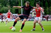 13 June 2025; Jay McClelland of St Patrick's Athletic tackles George Cooper of Drogheda United during the SSE Airtricity Men's Premier Division match between St Patrick's Athletic and Drogheda United at Richmond Park in Dublin. Photo by Shauna Clinton/Sportsfile
