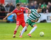 13 June 2025; Lee Grace of Shamrock Rovers is tackled by John Martin of Shelbourne during the SSE Airtricity Men's Premier Division match between Shelbourne and Shamrock Rovers at Tolka Park in Dublin. Photo by Stephen McCarthy/Sportsfile