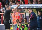 13 June 2025; Shelbourne manager Damien Duff is shown a yellow card by referee Rob Harvey during the SSE Airtricity Men's Premier Division match between Shelbourne and Shamrock Rovers at Tolka Park in Dublin. Photo by Stephen McCarthy/Sportsfile